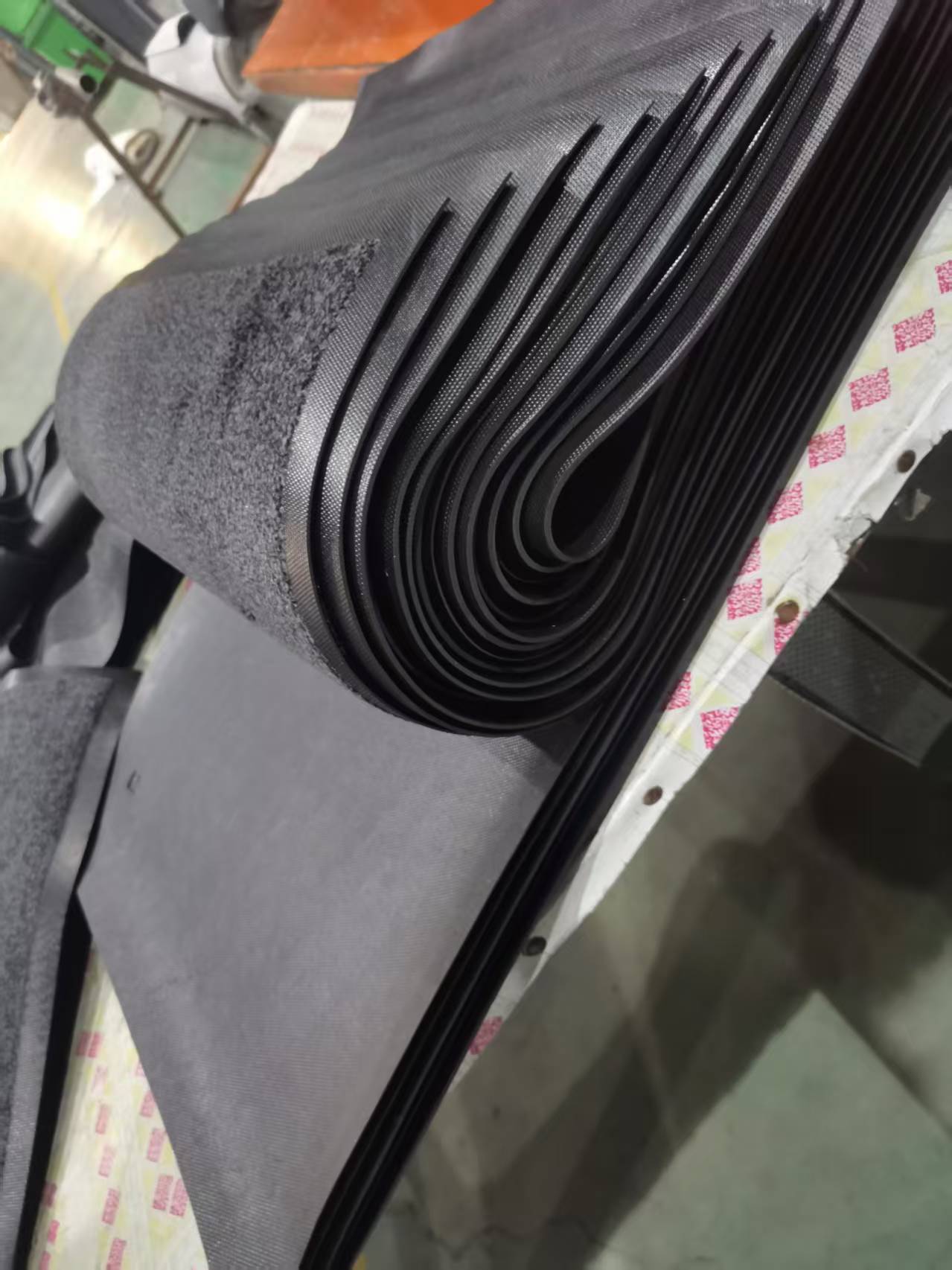 Rubber backing construction